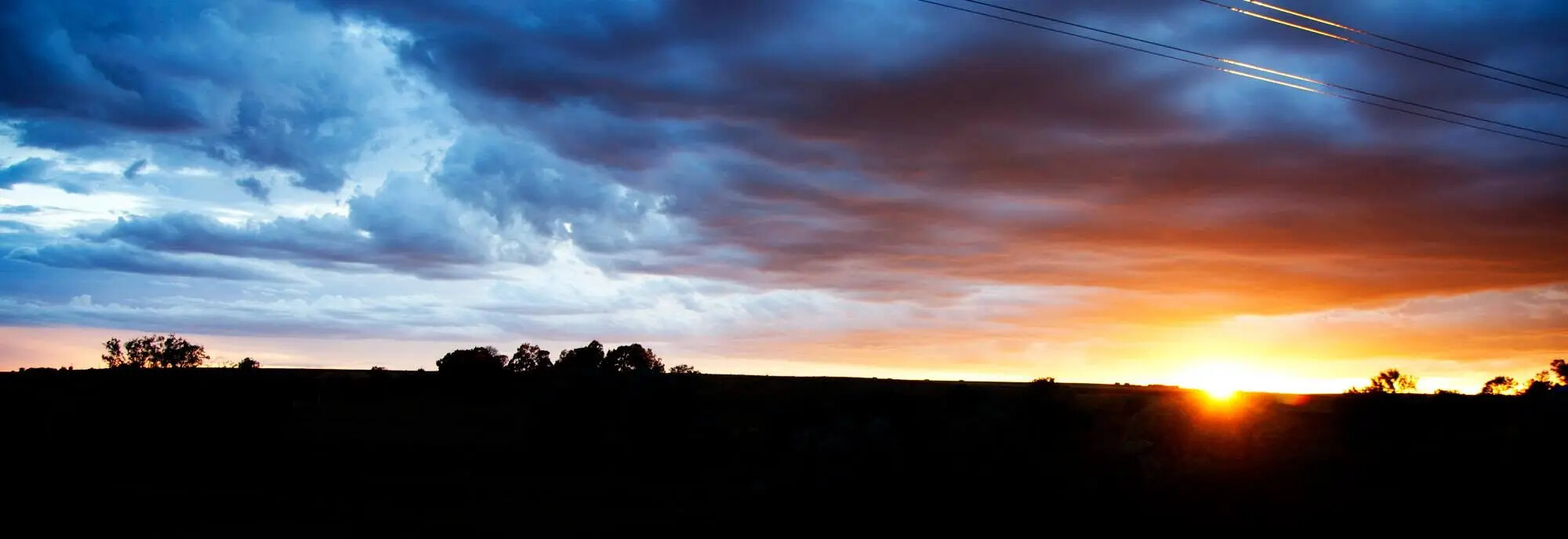 A distant horizon at sunset, photographed by Rodney Marullo