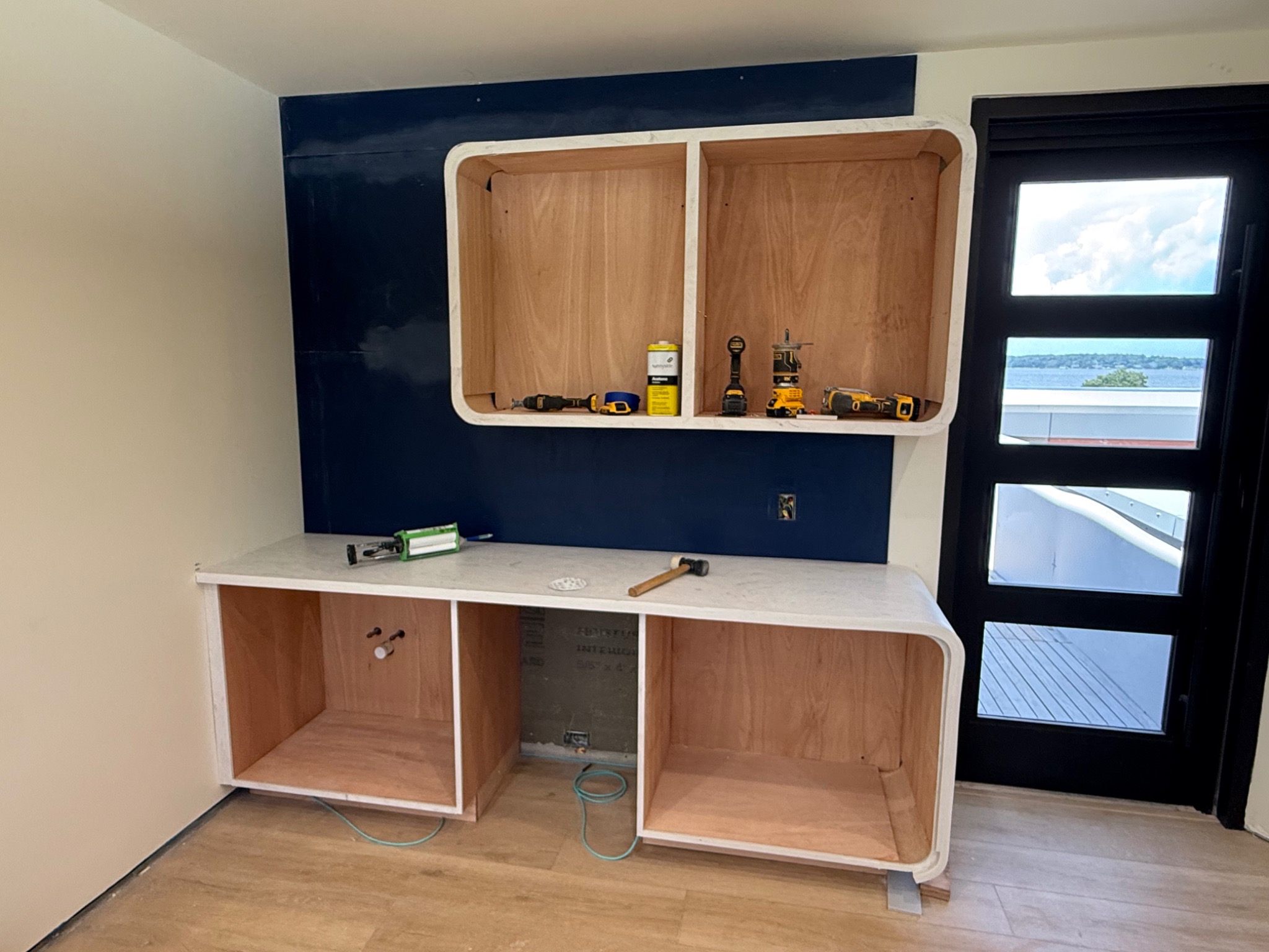 Curved custom bar cabinetry at Kohola House