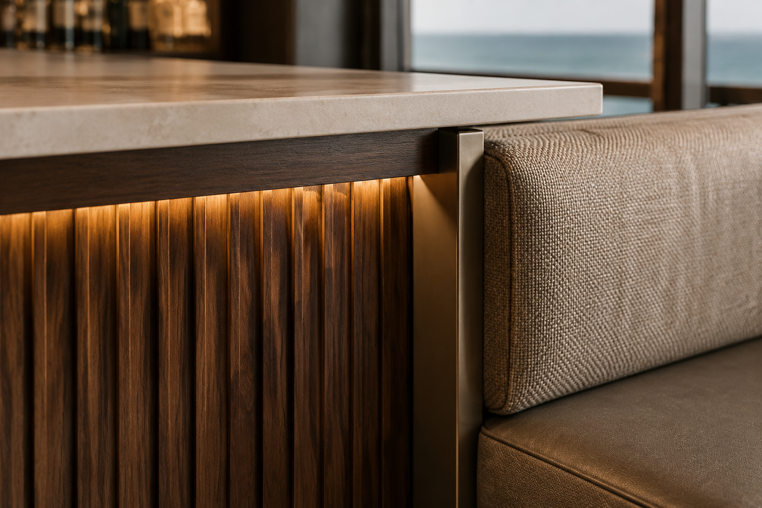 Close material study of fluted walnut, aged bronze, pale limestone, warm concealed lighting, and tailored upholstery